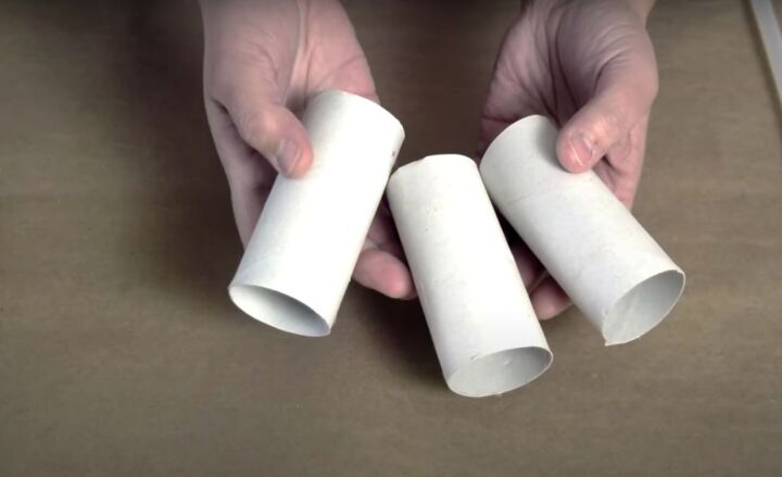 how to make festive glitter toilet paper roll snowflakes, Three white toilet paper tubes