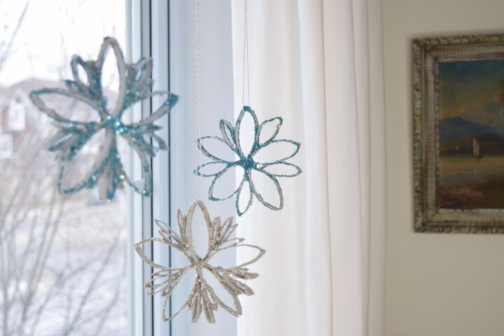 how to make festive glitter toilet paper roll snowflakes, Snowflake ornaments made from toilet paper rolls