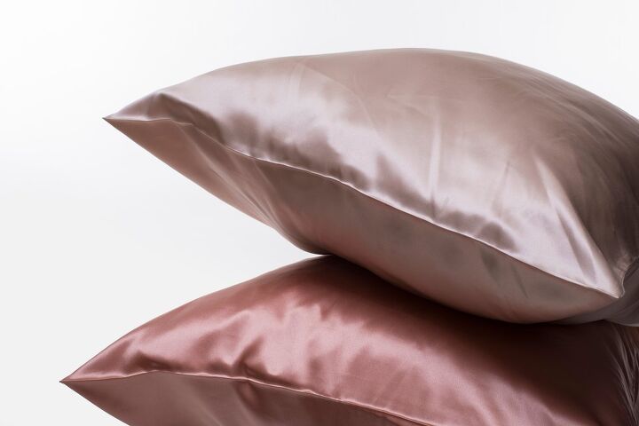 best silk pillowcases, two silk pillowcases in different shades of pink Photo via Shutterstock