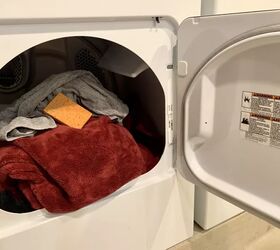 the top 7 best dryers of 2022, open dryer filled with clothes Photo via Rebecca RestyledHomes