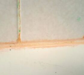 how to get rid of pink mold, pink mold on crease of white shower tile