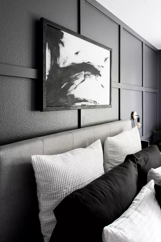 how to frame canvas art in 7 simple steps, black and white framed canvas art hanging over bed