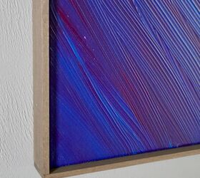 how to frame canvas art in 7 simple steps, blue and purple canvas painting with wood frame