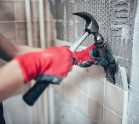 how to remove tile backsplash and replace drywall if needed, person removing tiles with hammer and chisel