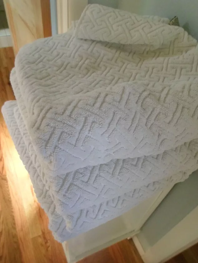 how to whiten laundry without bleach, stack of three textured white towels