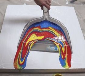 The crazy reason this woman fills a dustpan with watered-down paint