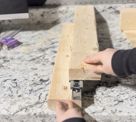 She hangs drawer slides inside her cabinet for a brilliant storage hack