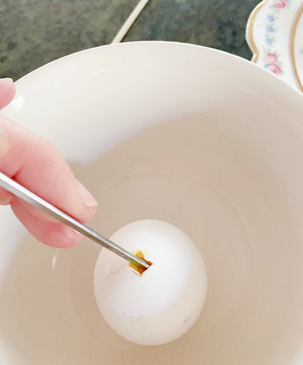 how to make decoupage easter eggs, Lightly tap in a hole at both ends