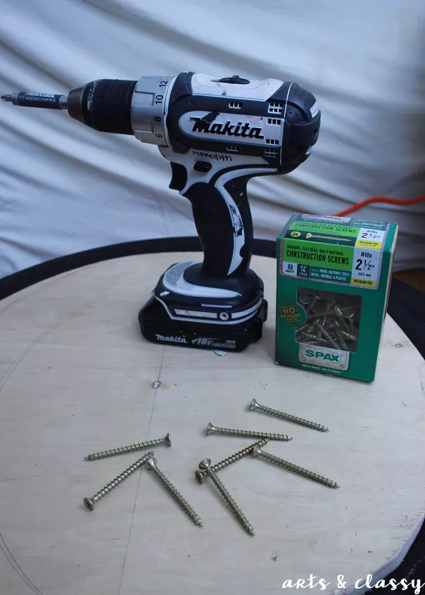 best cordless power drills, white and black power drill with box of screws photo via Meredith Schneider