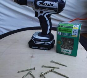 the 4 best cordless power drills of 2022, white and black power drill with box of screws photo via Meredith Schneider