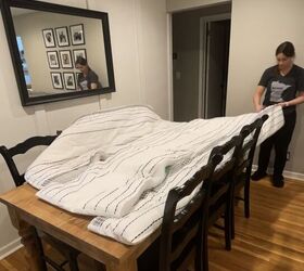 She cuts an old comforter in half for this brilliant living room upgrade