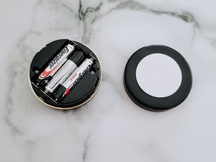 5 steps to a super simple puck light hack, Install batteries and place double sided tape onto the battery cover