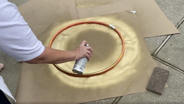 how to make a gorgeous outdoor hula hoop chandelier, Spray paint the hula hoops