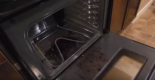 how to replace an oven heating element, inside of oven with racks removed and heating element attached
