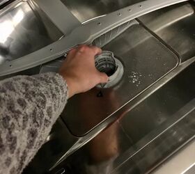 how to unclog a dishwasher that won t drain, hand removing filter from dishwasher