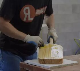 how to clean a wood cutting board disinfect it and lift pesky stains, person rubbing oil on wood cutting board