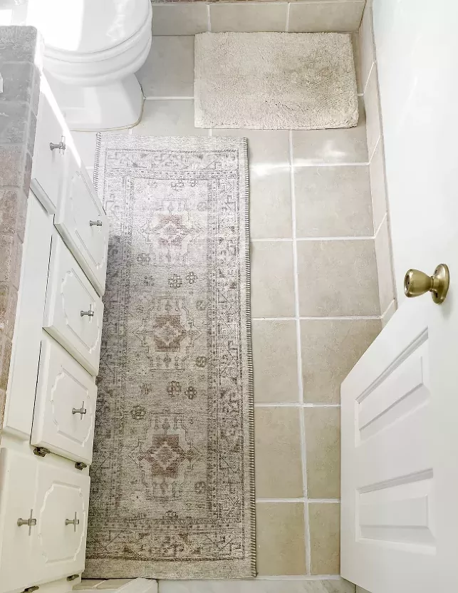 how to tile over tile, overhead shot of tile bathroom floor