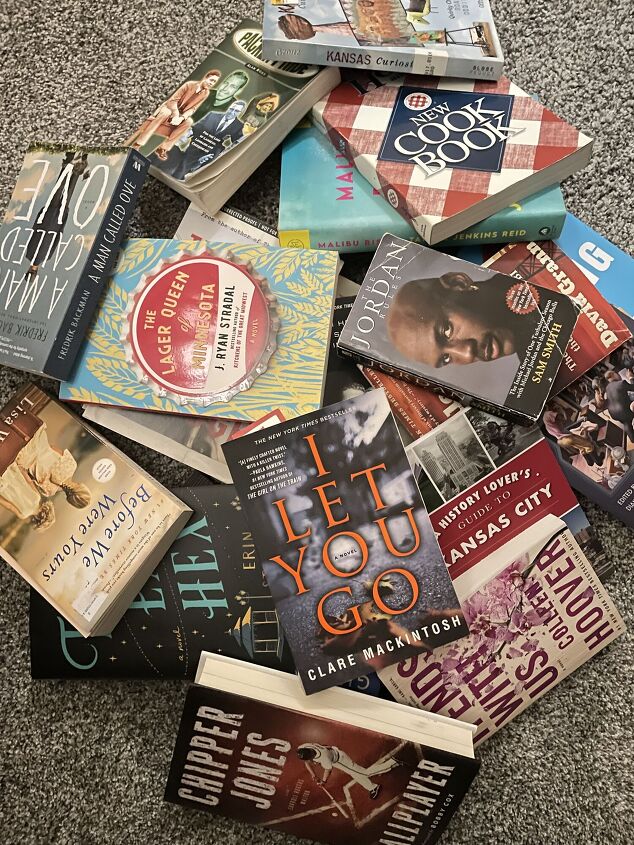 how to declutter books, pile of books on floor