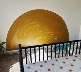 These parents paint half a circle on their nursery wall for a beautiul, 30-minute refresh