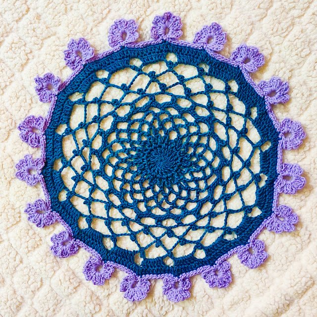 alfombra de flores de ganchillo con encanto