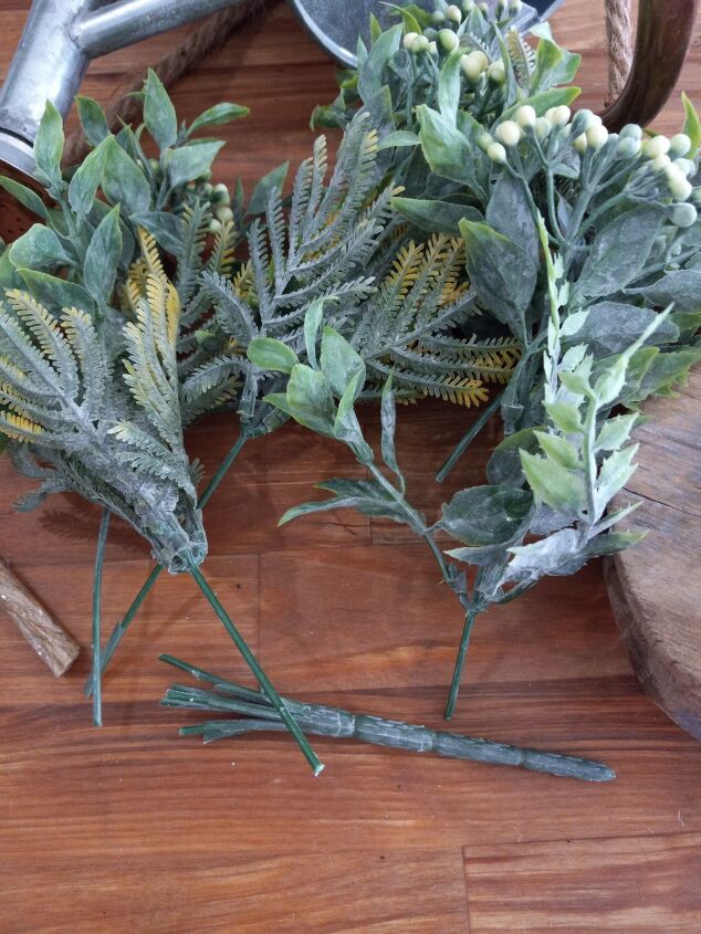 how to make a cute farmhouse pulley hanging bucket planter, Cutting the faux foliage into individual pieces