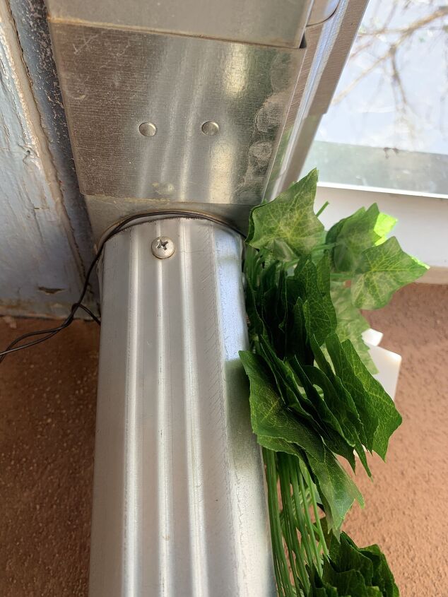 diy drain pipe concealment with ivy and fairy lights so easy