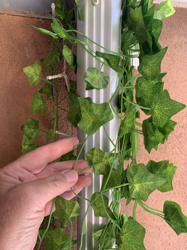 diy drain pipe concealment with faux ivy and fairy lights so easy