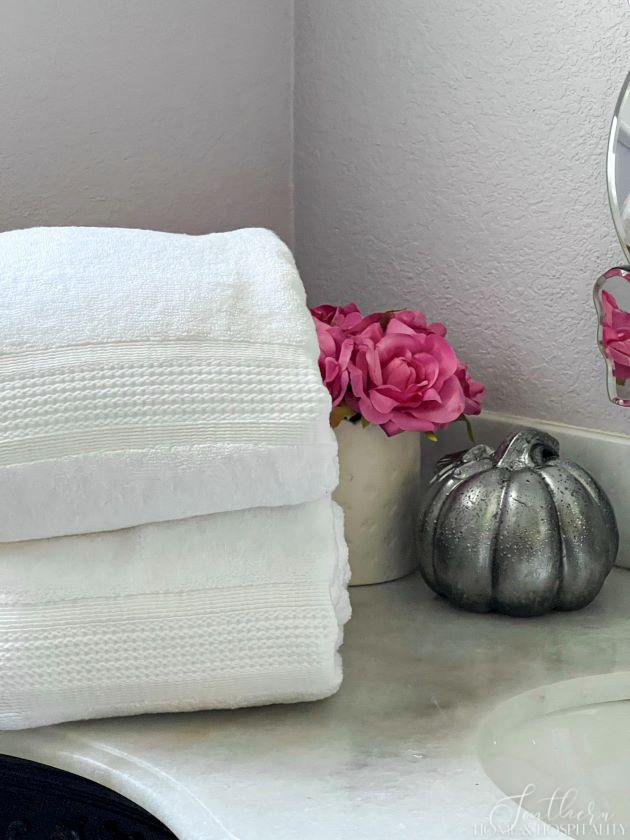 how to upcycle old ceramic decor into aged metal, See the pumpkins showing off their new makeover in the guest rooms