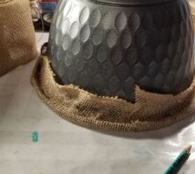 She wraps a plastic planter in burlap trim for this pretty, low-maintenance porch idea