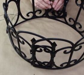 how to make the cutest outdoor dollar tree fence basket, Securing the circular basket sides with floral wire