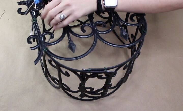 how to make the cutest outdoor dollar tree fence basket, Cutting off excess plastic