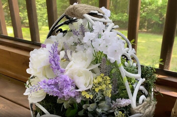 how to make the cutest outdoor dollar tree fence basket, Homemade rustic basket filled with flowers