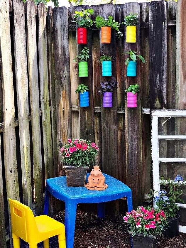 recycled rainbow herb garden from tin cans