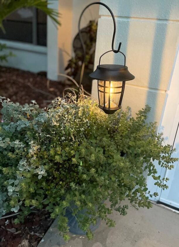 add interest to your garden with hanging solar lanterns