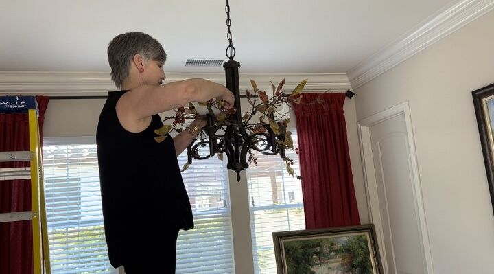my dining room chandelier makeover before and after, Here I am weaving in the smaller branches to make a bit of a grid