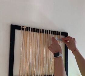 She wraps raffia around an empty frame for a simple craft we never would've thought of