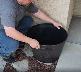 mesmerize your guests with this fancy floating fountain diy, Placing a large plastic planter on the porch