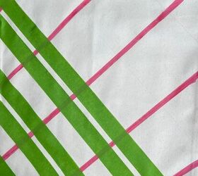 She puts strips of tape over pillow covers to give her living room a vibrant splash of summer color