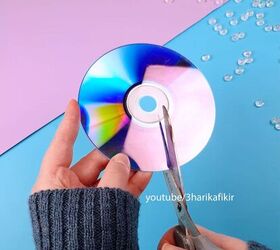 Cut up old CD's and grab a hair dryer to copy this cool wall accent