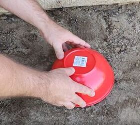 He uses a plastic Dollar Tree bowl for the smartest way to hide his outdoor eyesore