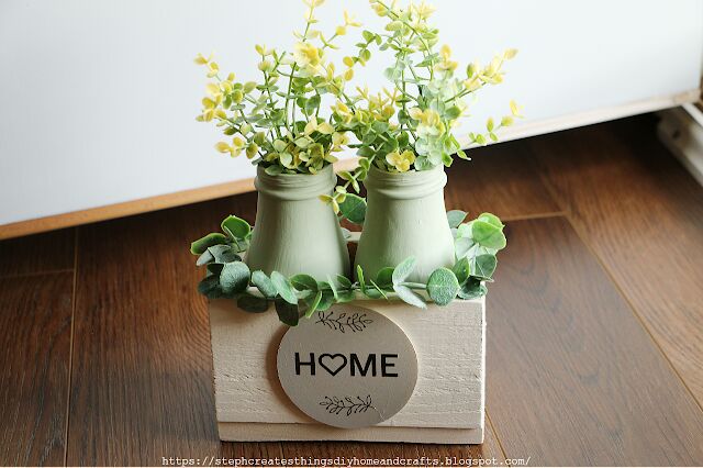decorative centerpiece wood box with glass bottles