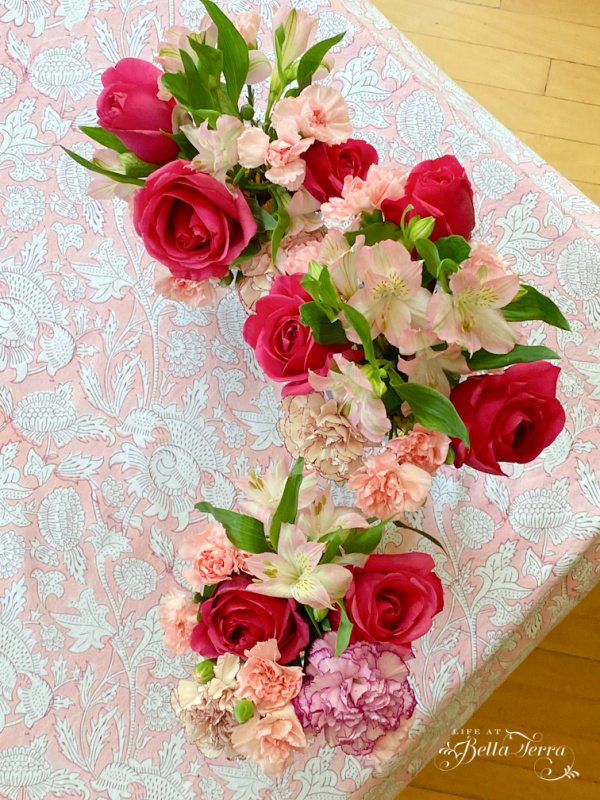 it s summer and cool down with an ice cream social, Flowers fill one corner of the table