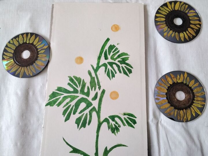 mixed media art pocket c d s repurposed into sunflowers, Leaf Stencil completed