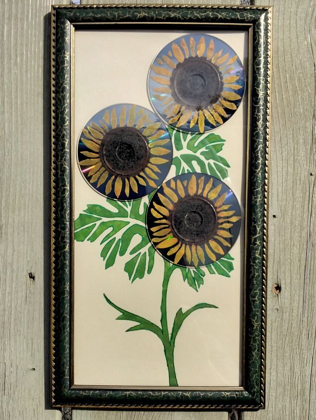 mixed media art pocket c d s repurposed into sunflowers, Hanging on My Fence