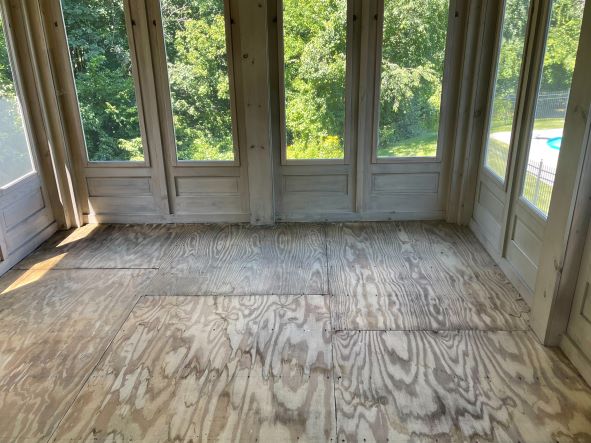 is a plywood subfloor with outdoor carpeting glued on appropriate for