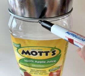 She puts a tin can over a juice bottle for this truly unique decor idea