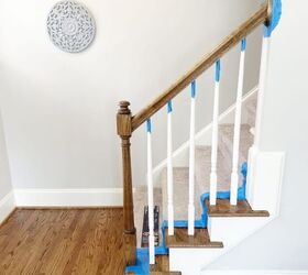 Give white boring staircases a pop of sleek sophistcation with this easy upgrade