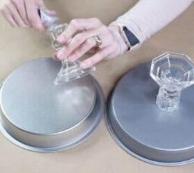 She glues 2 candlesticks to 2 cake pans for this gorgeous, $10 idea