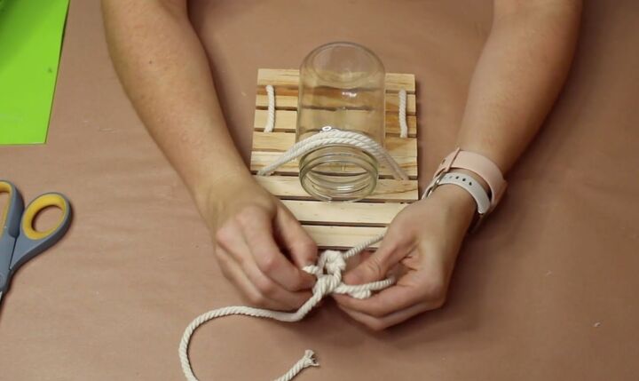 how to make a nautical mason jar lamp in 6 easy steps, Making a bow with the rope