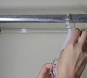 She hangs shower curtain rings from her closet rod for this super simple hack